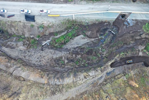 Aerial view of an emergency Caltrans project to install drainage culverts on State Route 89 near Markleeville, California (about 30 miles south of Lake Tahoe) where the road is closed in both directions for approximately three miles due to a mudslide. On August 3, heavy rainfall in the area of the July 2021 Tamarack Fire burn scar caused the debris flow that washed out the road.